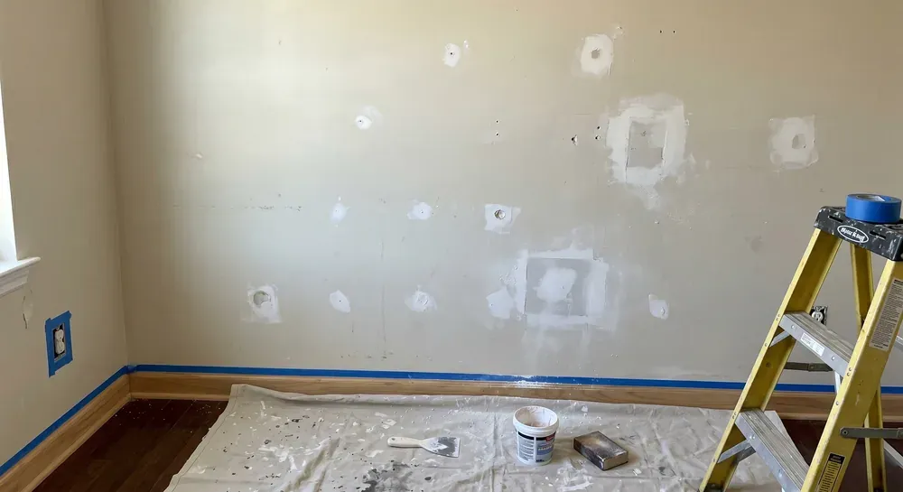 Cornerstone painter carefully preparing interior walls and surfaces